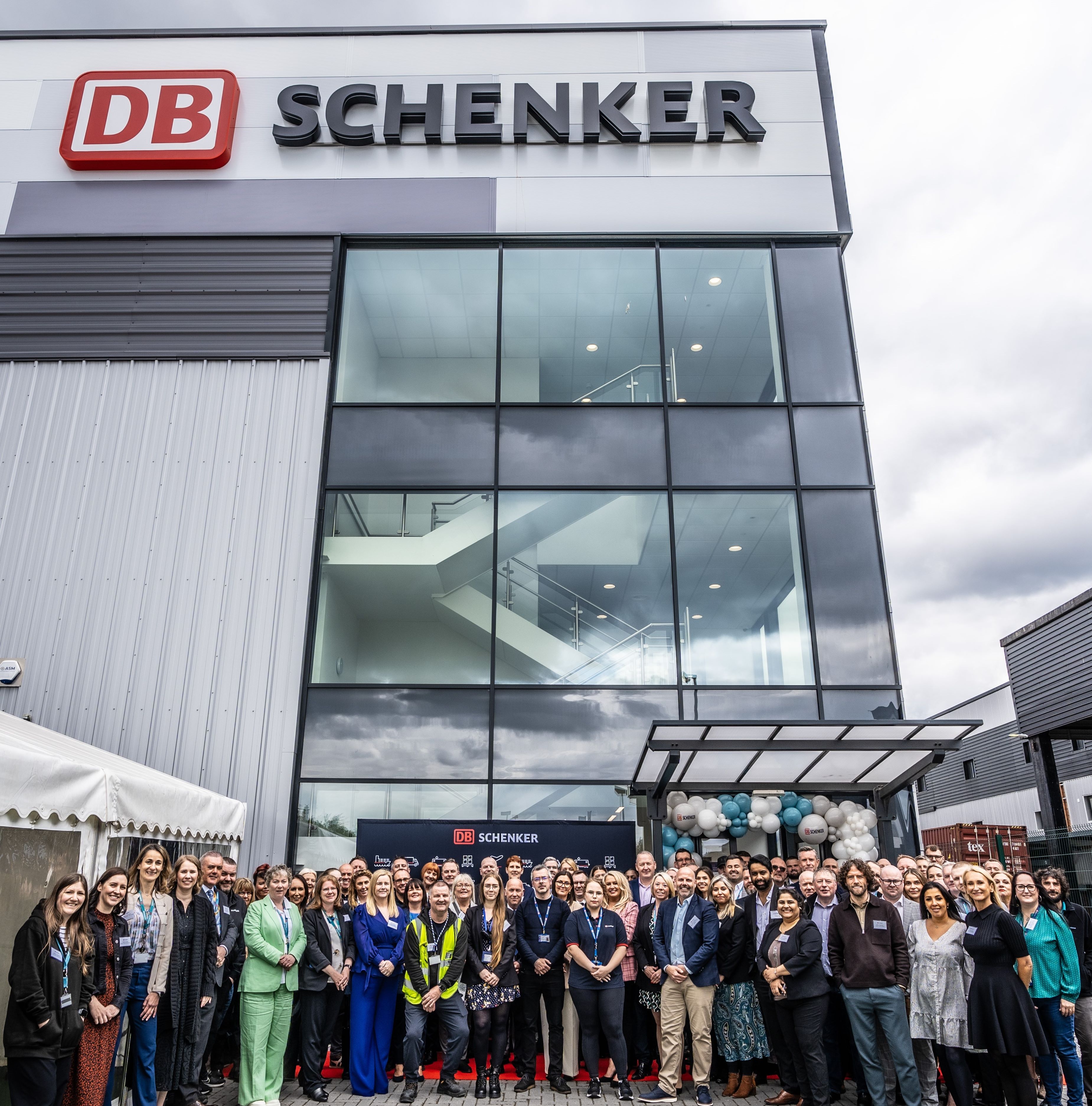 DB Schenker team gather in front of their new facility at Trafford Park